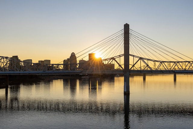 Bridge across a river at sunset