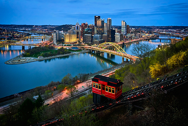 Aerial photo of bridge and buildings under blue sky photo